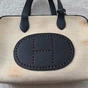 Vintage pre-loved Hermes canvas bag and leather trim and logo